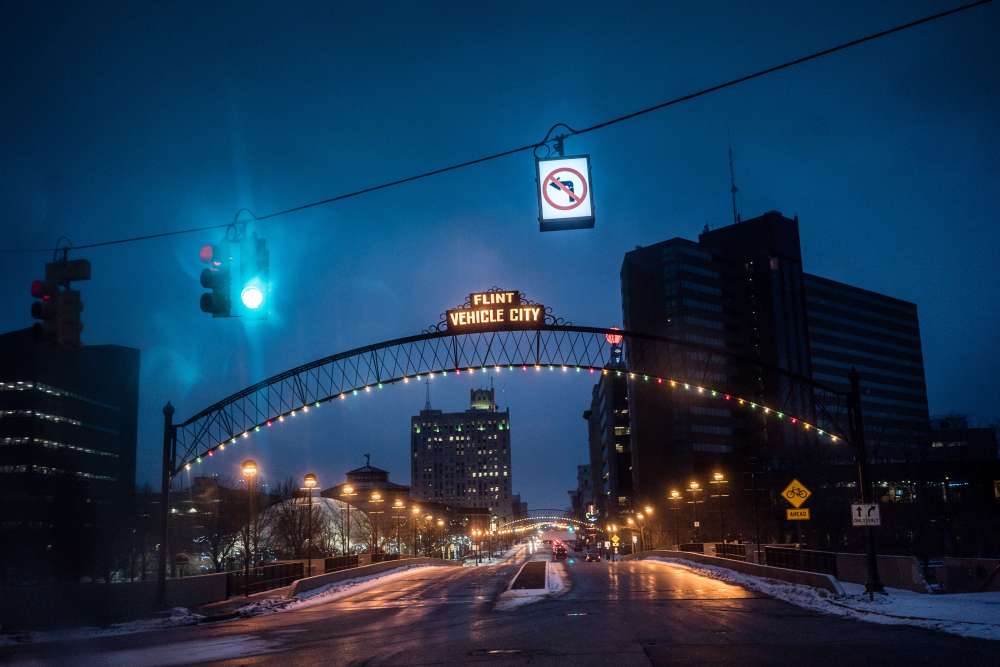 The iconic Vehicle City sign hangs over the entrance to Downtown Flint.